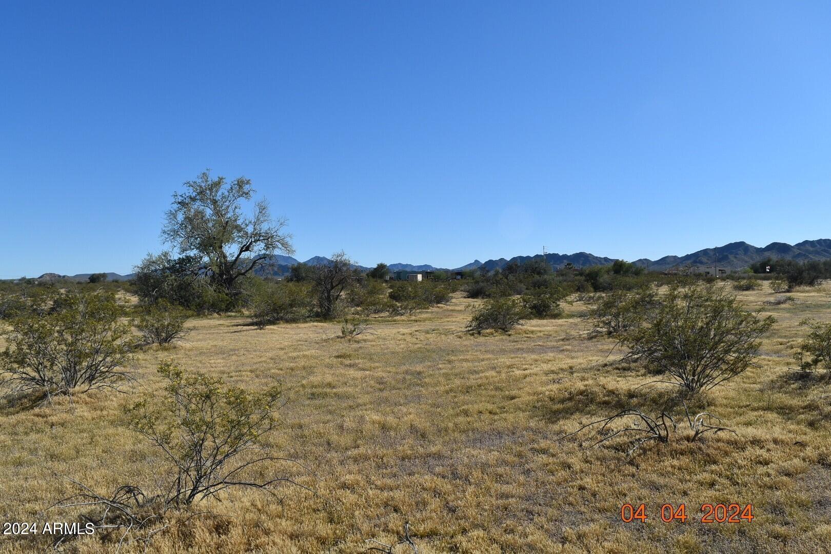 524-xx West Organ Pipe Road, Unit B Maricopa, AZ 85139 - Photo 8 of 9 a view of lake with mountain