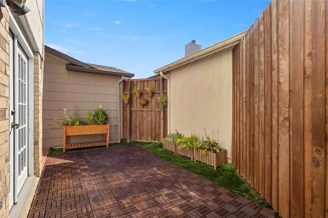 a backyard of a house with outdoor seating
