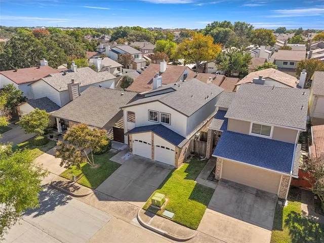 an aerial view of a house with a garden