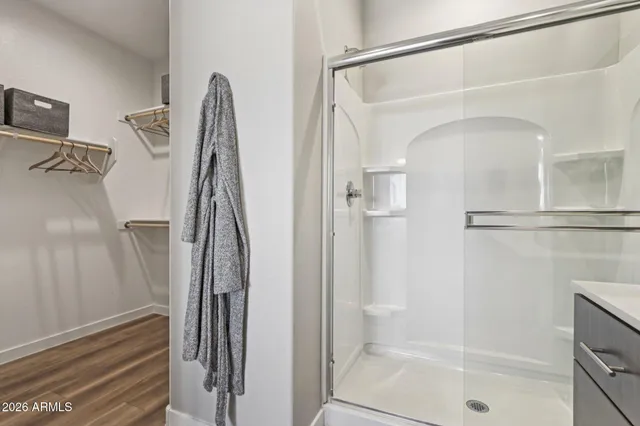 a bathroom with a double vanity sink and mirror