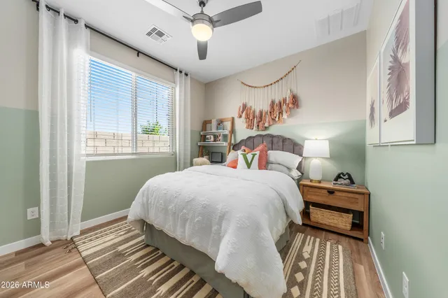 a bedroom with a bed and a window