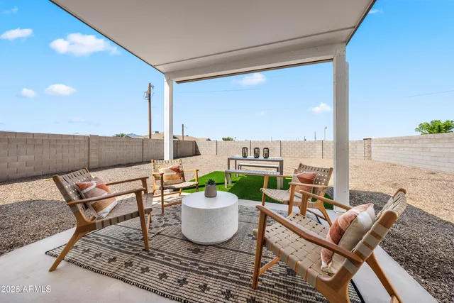 a view of a porch with furniture and a potted plant
