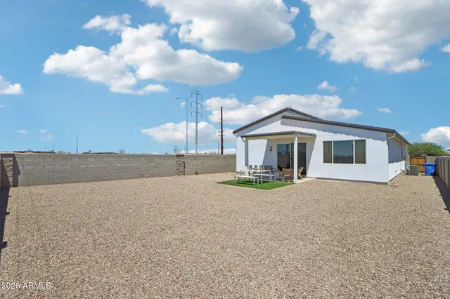 a front view of a house with yard and hallway