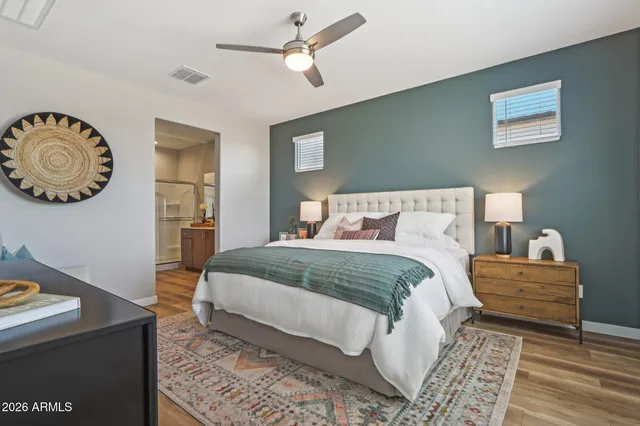 a workspace with furniture wooden floor and a rug