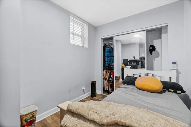 a bedroom with a bed and a lamp