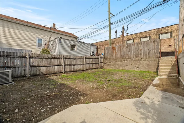 an aerial view of a house with a outdoor space