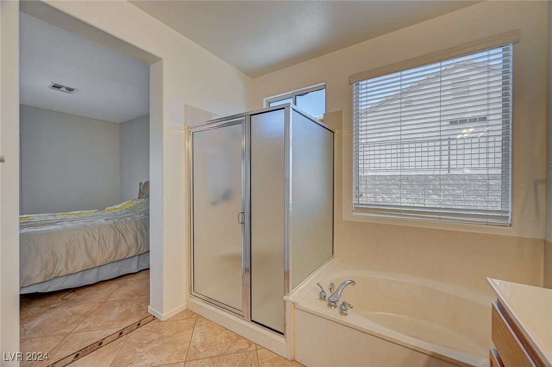 3054 Fort Stanwix Road Henderson, NV 89052 - Photo 38 of 52 Shower and soaking tub