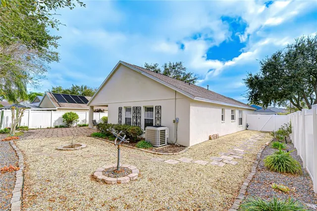a house view with a backyard space