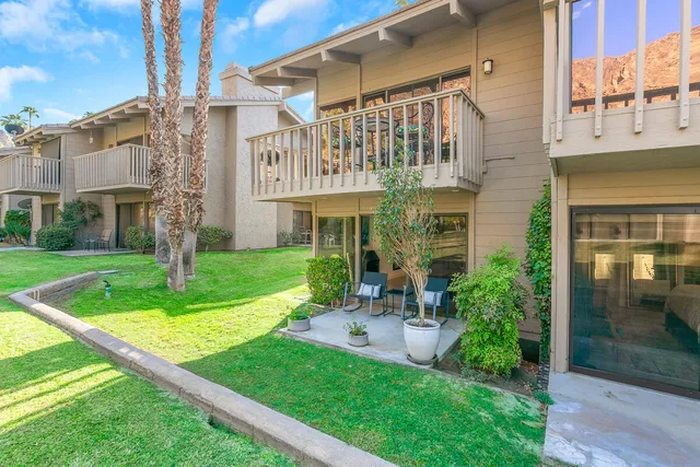 a front view of a building with garden