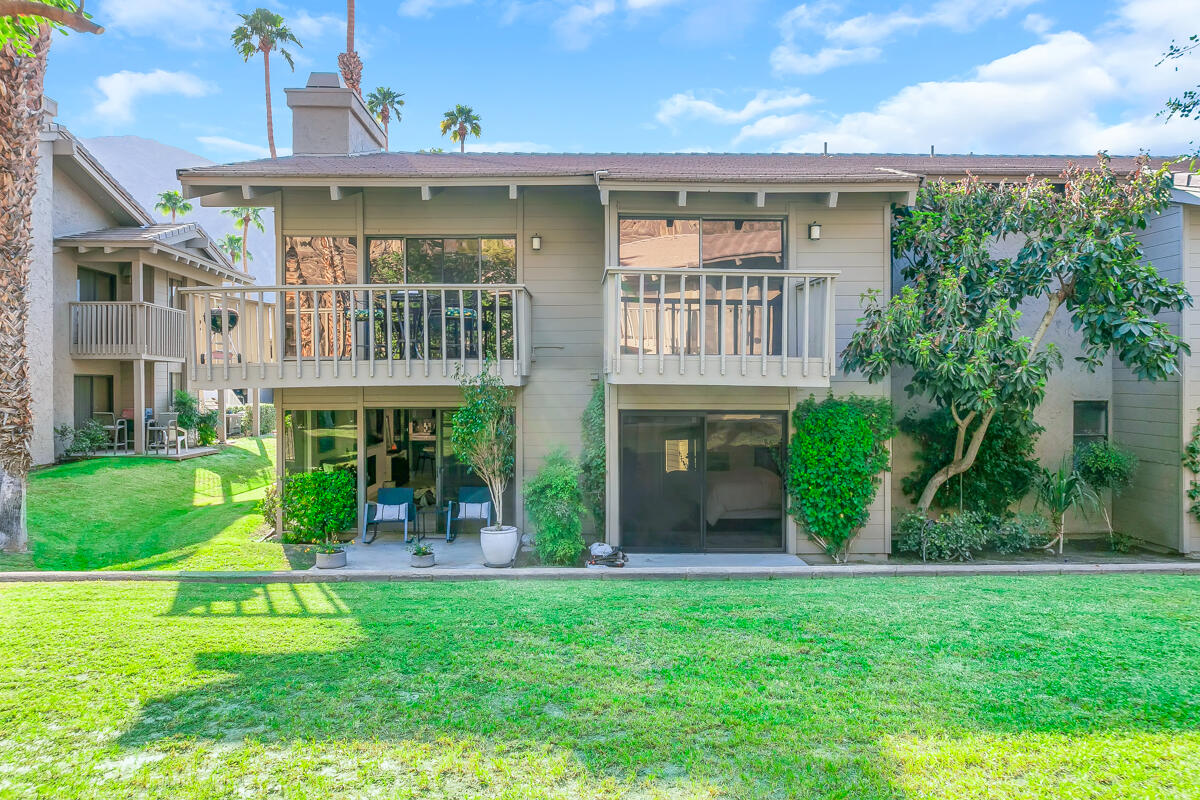 46644 Arapahoe, Unit A Indian Wells, CA 92210 - Photo 25 of 29 a view of a big yard in front of a brick house