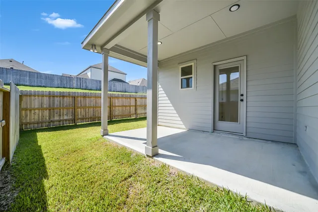 a view of a backyard with potted plants