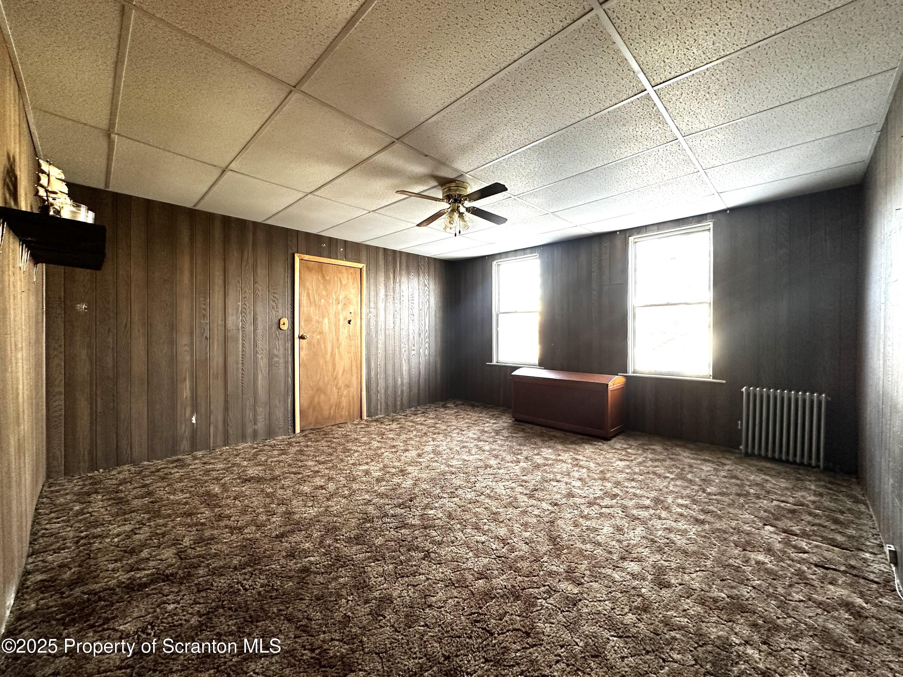 514 East Market Street Scranton, PA 18509 - Photo 13 of 33 a view of a livingroom with a ceiling fan and window