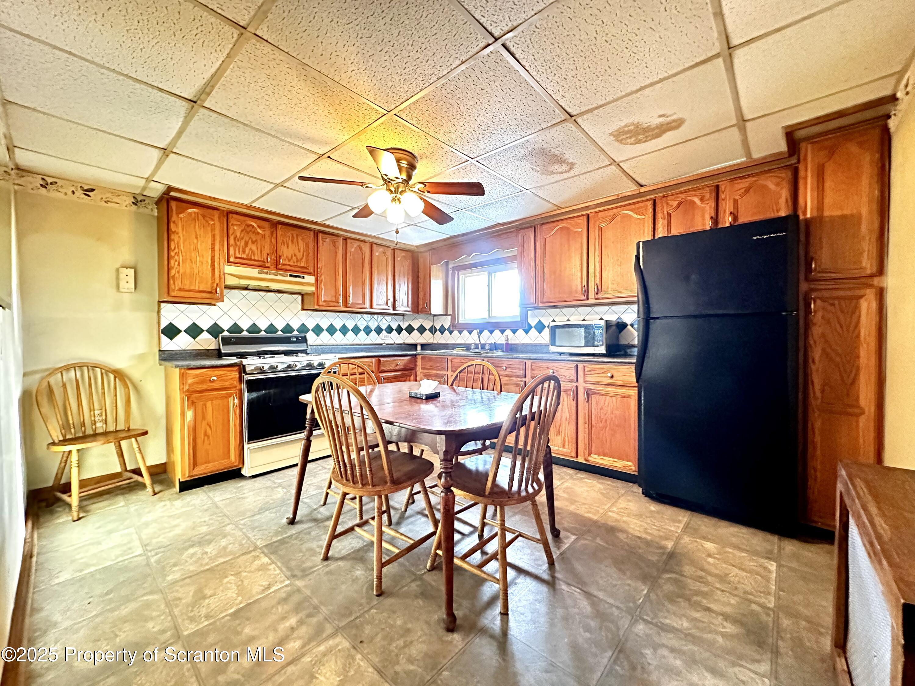 514 East Market Street Scranton, PA 18509 - Photo 4 of 33 a view of a dining room with furniture and a window