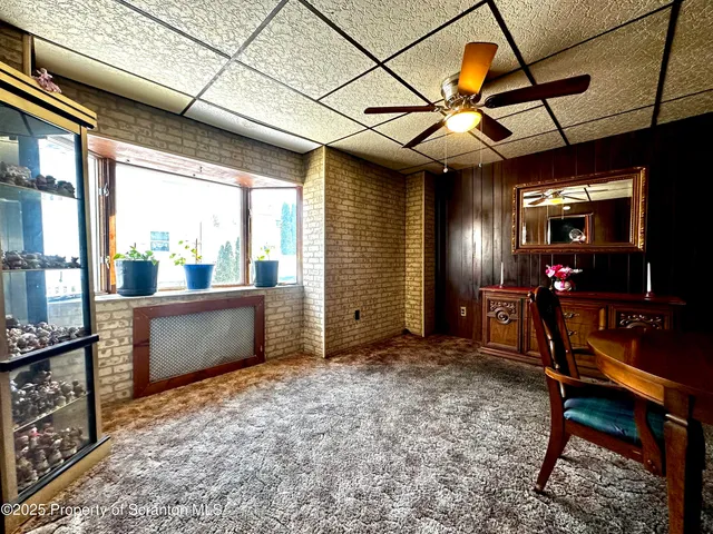 a view of a room with window and furniture
