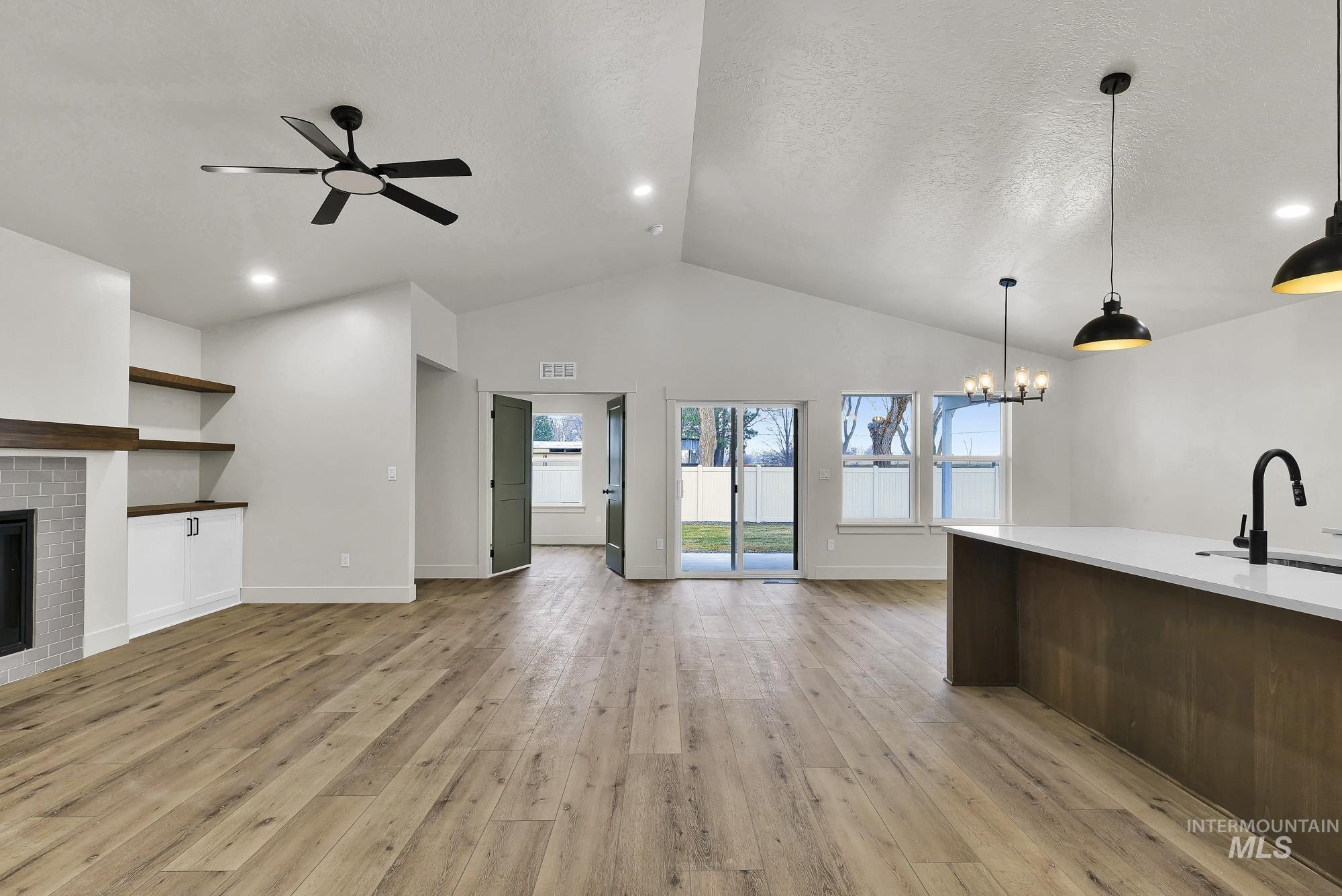 1130 Velvet Loop Wilder, ID 83676 - Photo 4 of 35 Vaulted ceilings with recessed lighting and a black ceiling fan