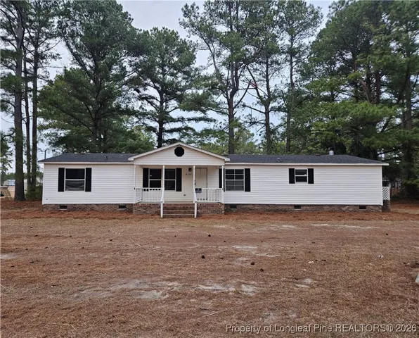 a house with trees in front of it