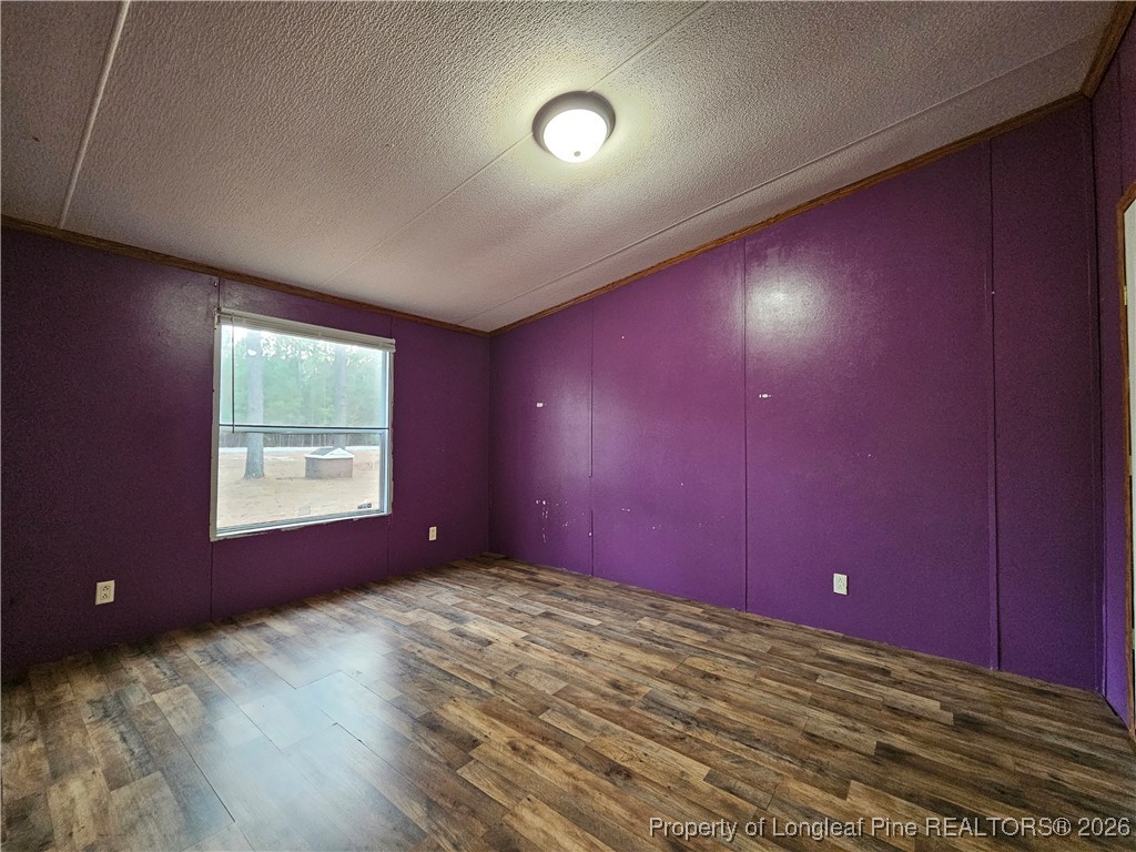 21981 McIntosh Road Wagram, NC 28396 - Photo 15 of 23 a view of an empty room and window
