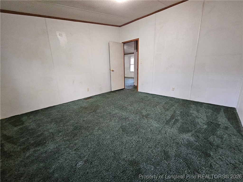 21981 McIntosh Road Wagram, NC 28396 - Photo 18 of 23 a view of an empty room and window