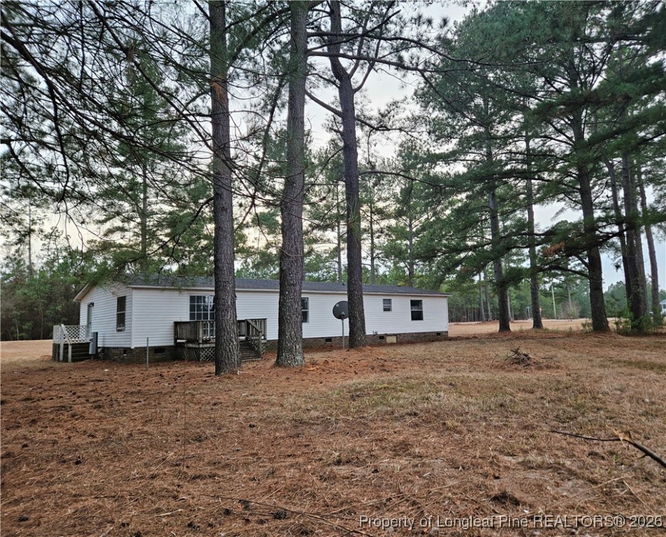 21981 McIntosh Road Wagram, NC 28396 - Photo 20 of 23 a house view with a backyard space
