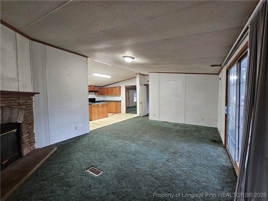 21981 McIntosh Road Wagram, NC 28396 - Photo 9 of 23 a view of an empty room and a kitchen