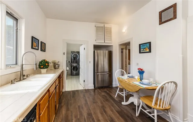 a dining room with furniture and wooden floor