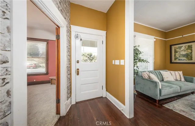 a living room with furniture and a gate