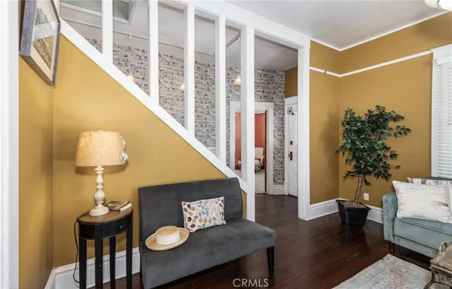 a living room with furniture and a lamp