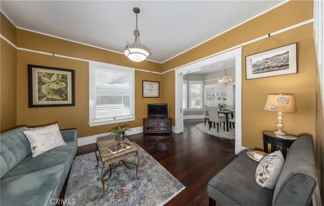 a living room with furniture or couch and a wooden floor