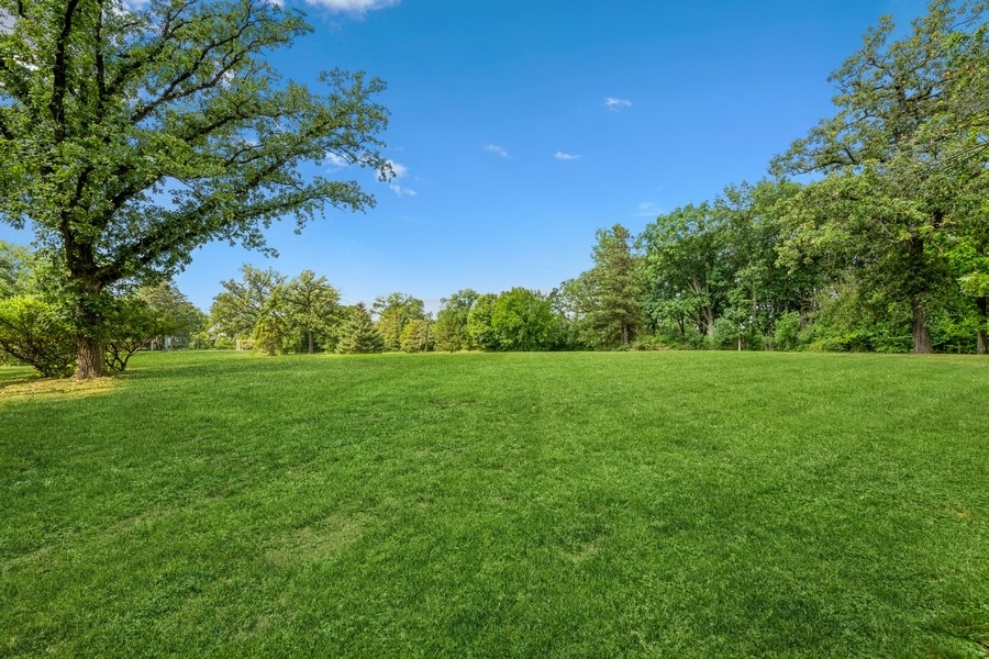 8000 South County Line Road Burr Ridge, IL 60527 - Photo 3 of 4 a view of a green field with wooden fence