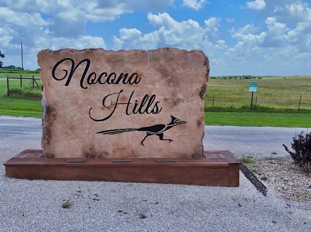 141 Diamond Oaks Drive Nocona, TX 76255 - Photo 13 of 16 a view of a park with welcome board