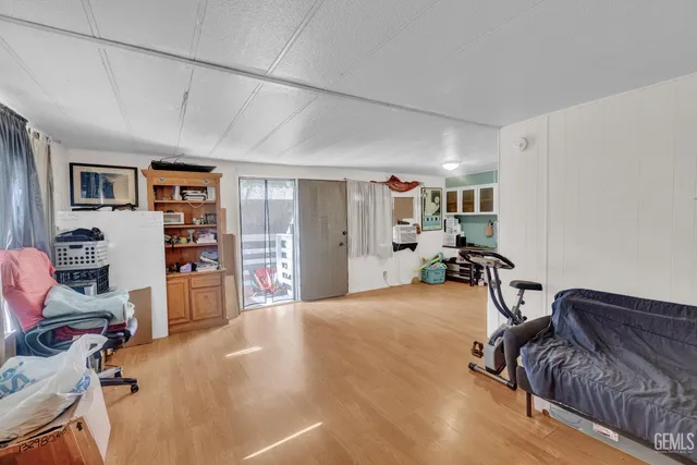 a view of a livingroom with workspace and a couch