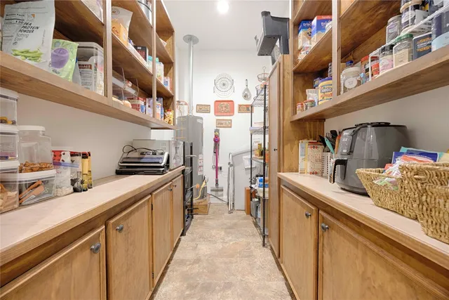 a room with furniture a rug and a window