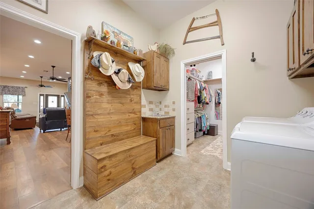 a bedroom with a bed dresser and a window