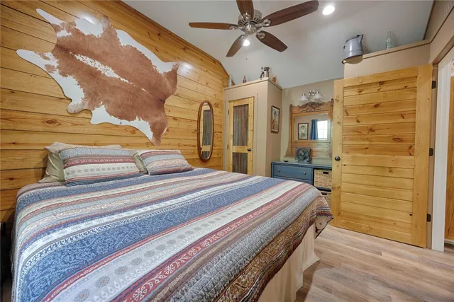 a bathroom with a granite countertop toilet and a shower