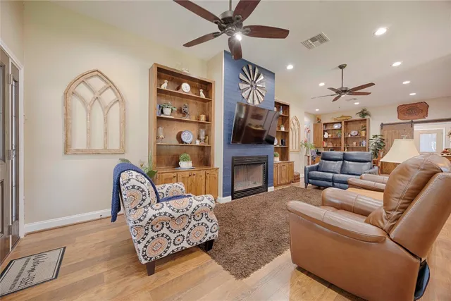 a large kitchen with a table and chairs