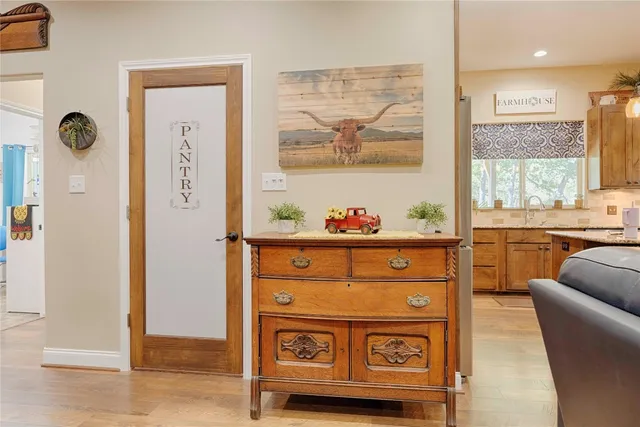 a kitchen with stainless steel appliances granite countertop a sink and cabinets