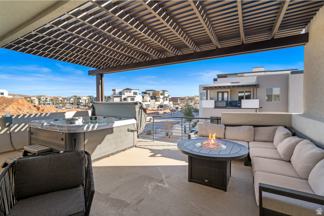 5482 Alice Blue Place St. George, UT 84790 - Photo 27 of 35 Upper patio with fire pit, hot tub, and TV