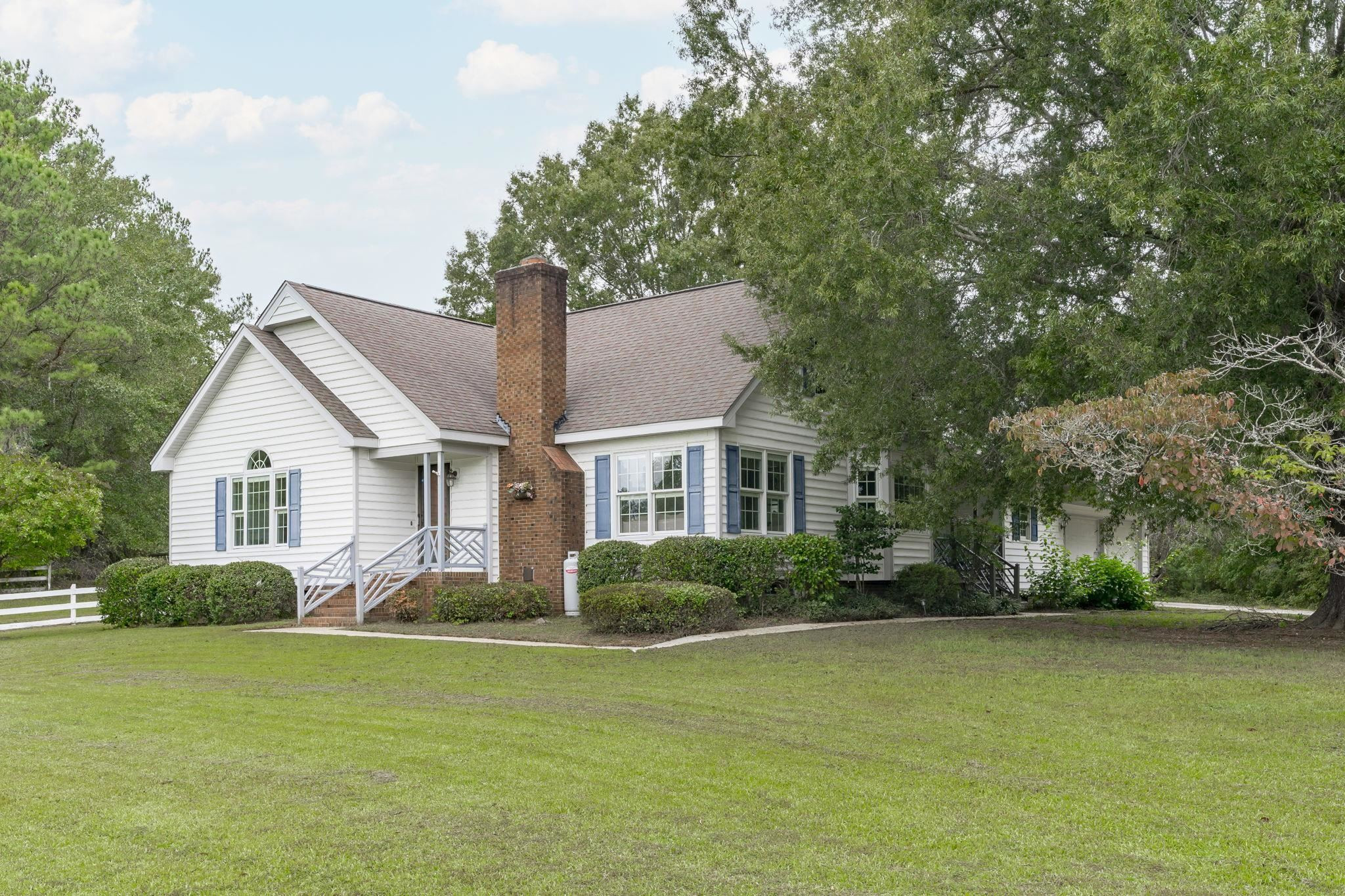 119 Lakeside Circle Willow Spring, NC 27592 - Photo 1 of 37 a front view of house with yard and green space