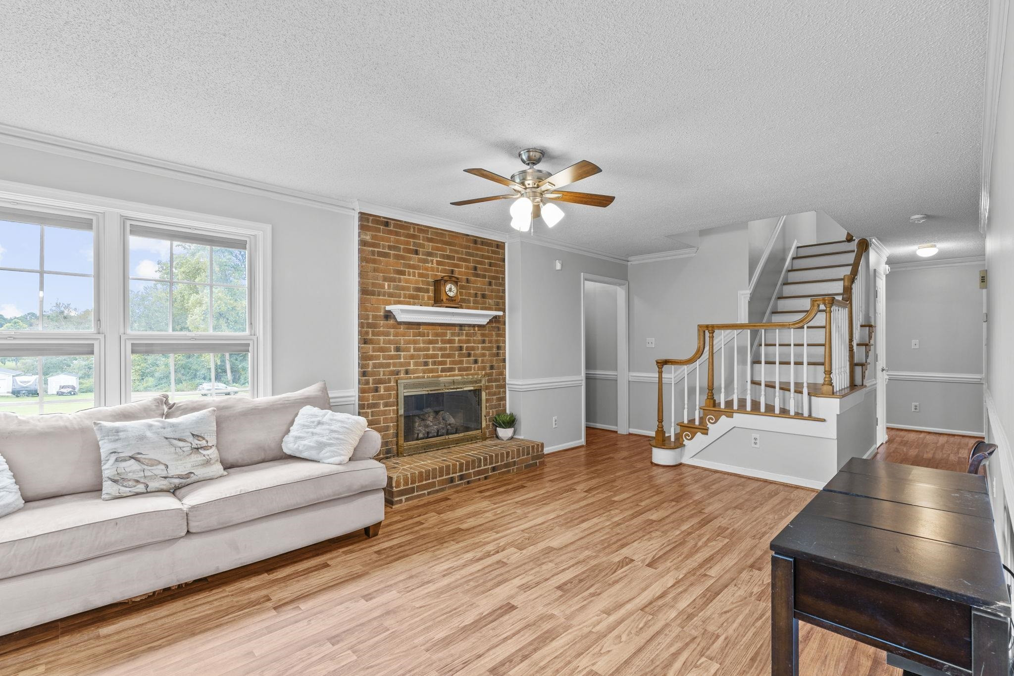 119 Lakeside Circle Willow Spring, NC 27592 - Photo 11 of 37 a living room with furniture and a fireplace
