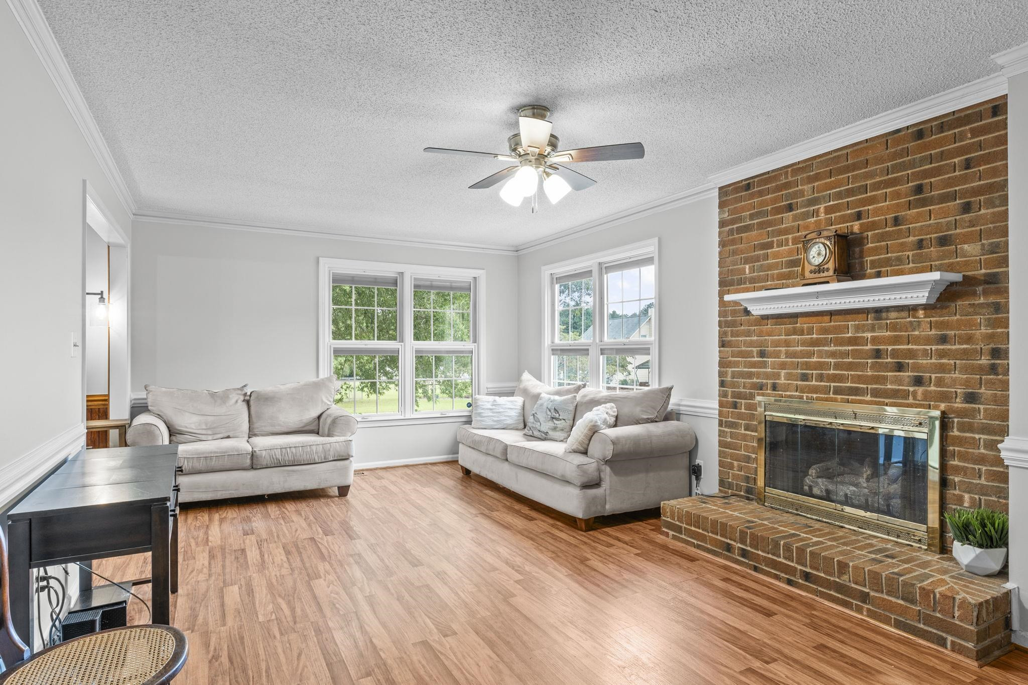 119 Lakeside Circle Willow Spring, NC 27592 - Photo 13 of 37 a living room with furniture a fireplace and a large window