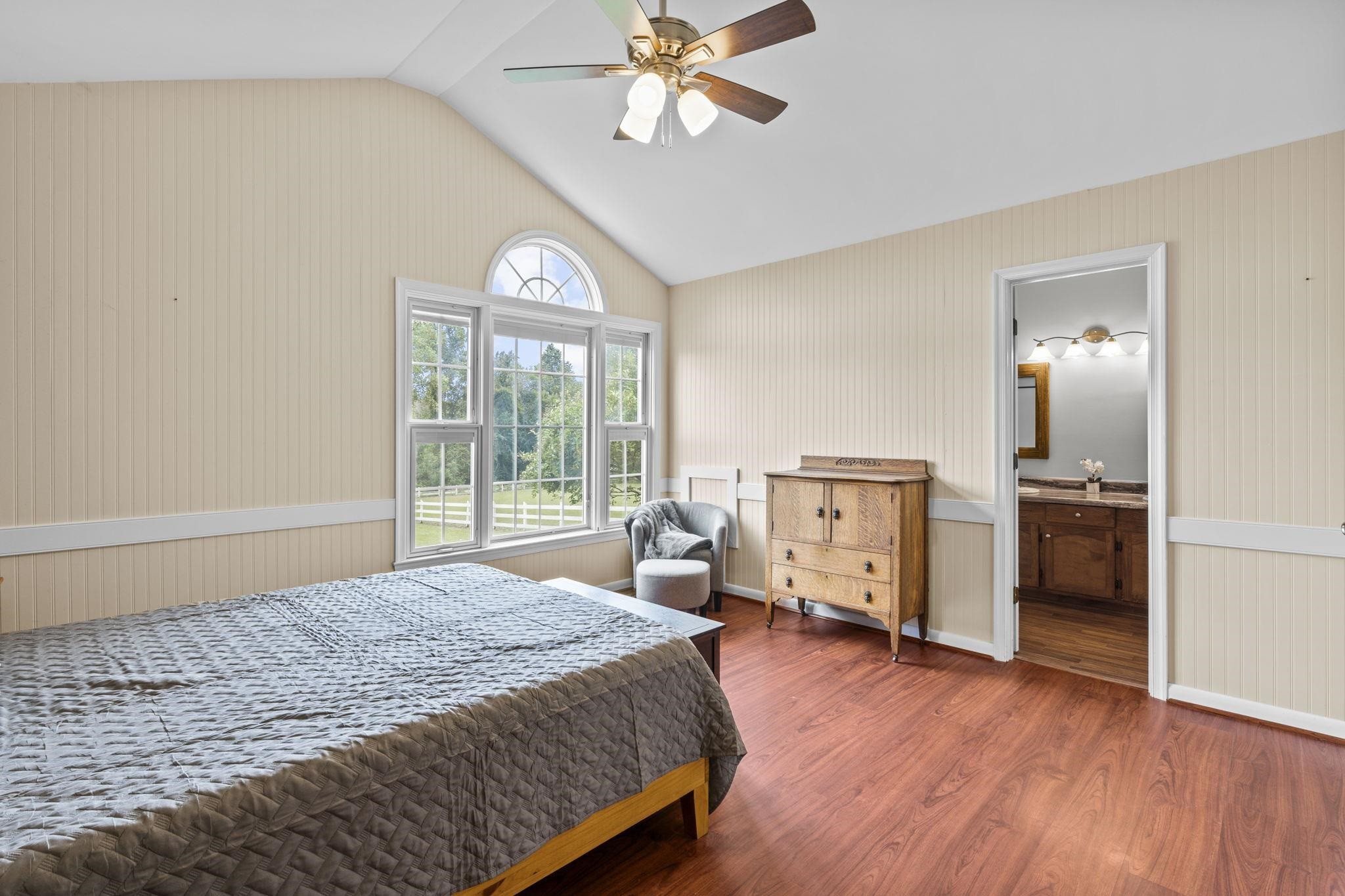 119 Lakeside Circle Willow Spring, NC 27592 - Photo 15 of 37 a bedroom with a bed and a chandelier