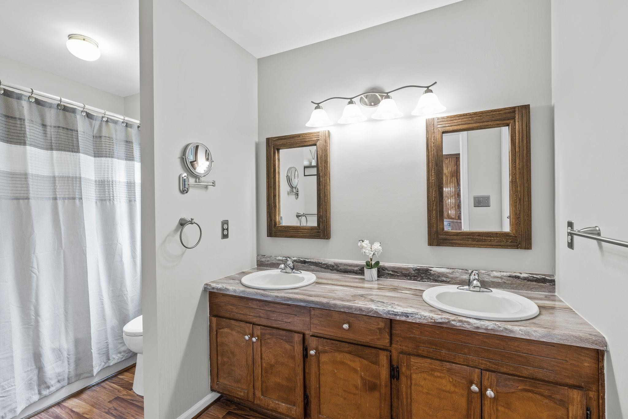 119 Lakeside Circle Willow Spring, NC 27592 - Photo 16 of 37 a bathroom with double sink and a mirror