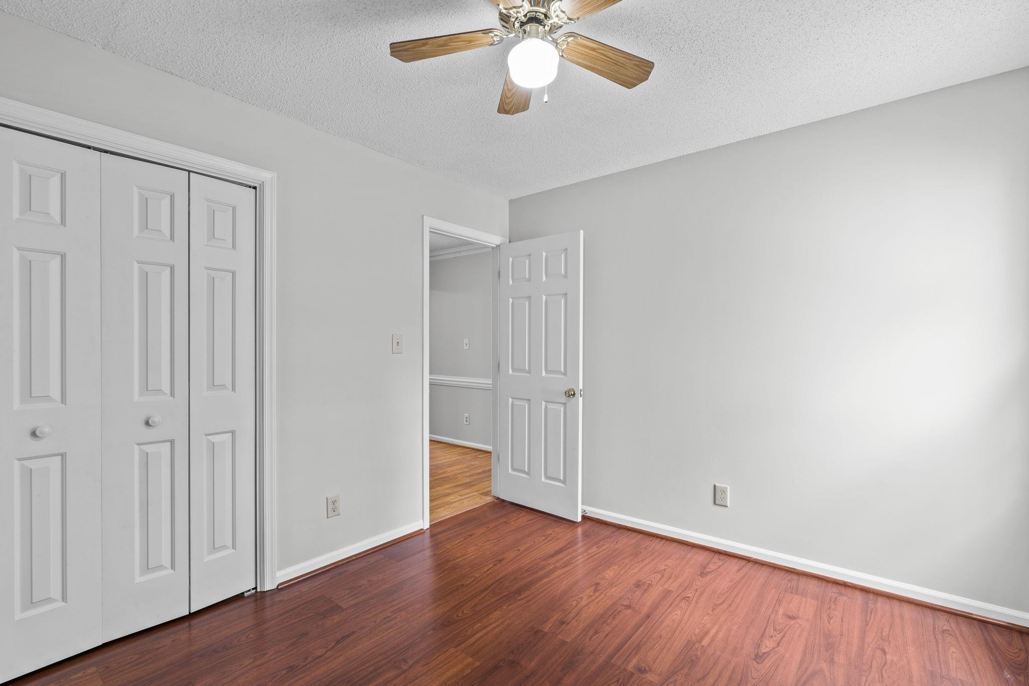 119 Lakeside Circle Willow Spring, NC 27592 - Photo 19 of 37 a view of an empty room with wooden floor