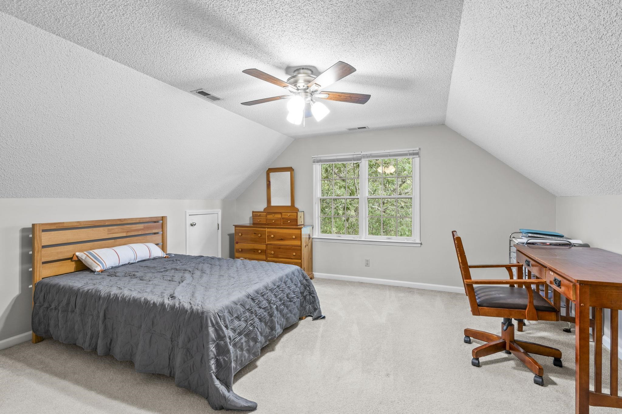 119 Lakeside Circle Willow Spring, NC 27592 - Photo 20 of 37 a bedroom with a bed and a desk