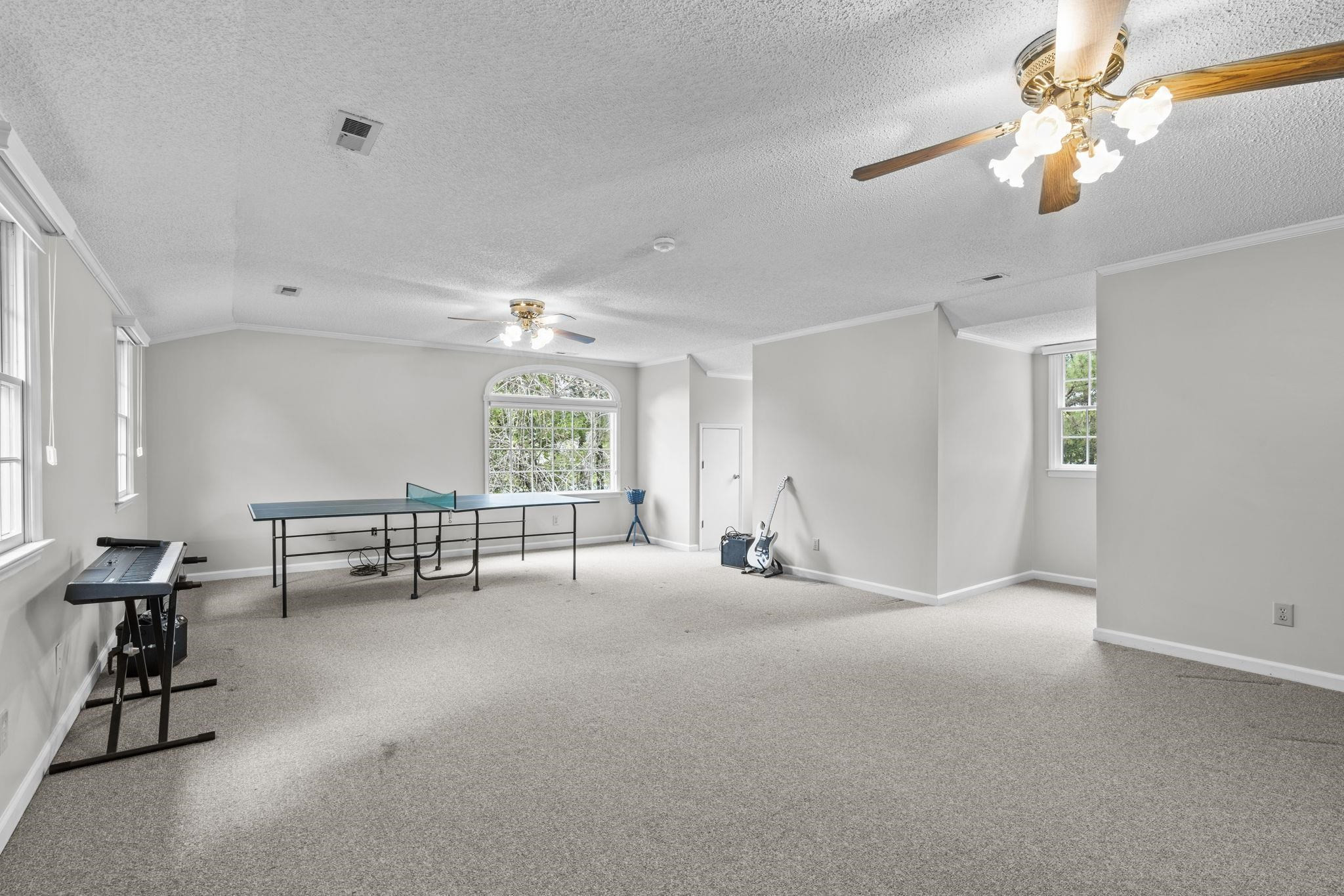119 Lakeside Circle Willow Spring, NC 27592 - Photo 21 of 37 a view of work space with windows and lounge chair