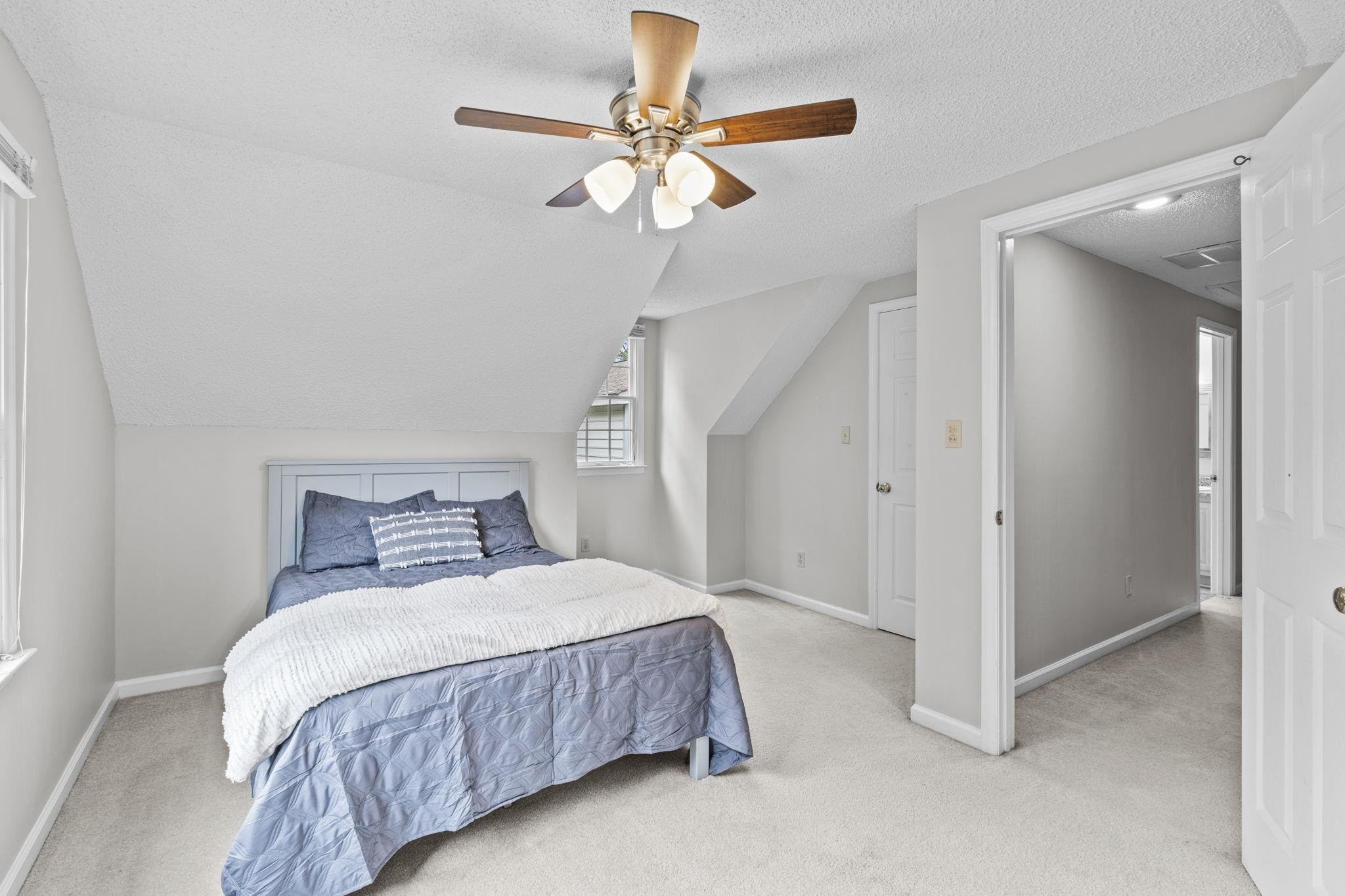 119 Lakeside Circle Willow Spring, NC 27592 - Photo 24 of 37 a bedroom with a bed and a chandelier