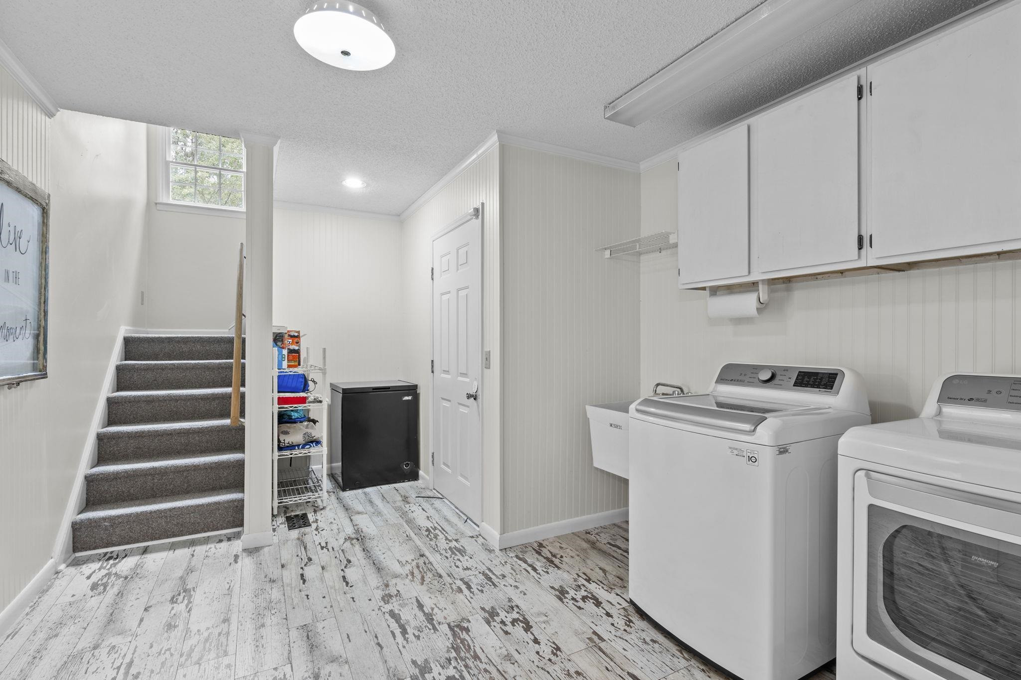 119 Lakeside Circle Willow Spring, NC 27592 - Photo 26 of 37 a view of a storage & utility room with washer and dryer