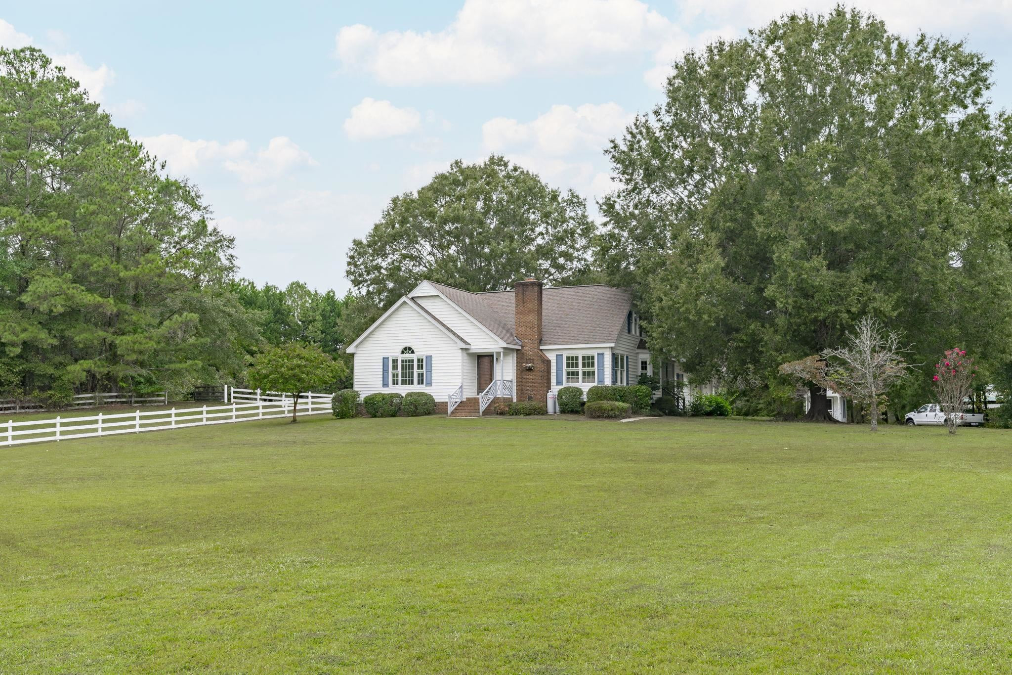 119 Lakeside Circle Willow Spring, NC 27592 - Photo 37 of 37 a view of a house with a big yard and large trees