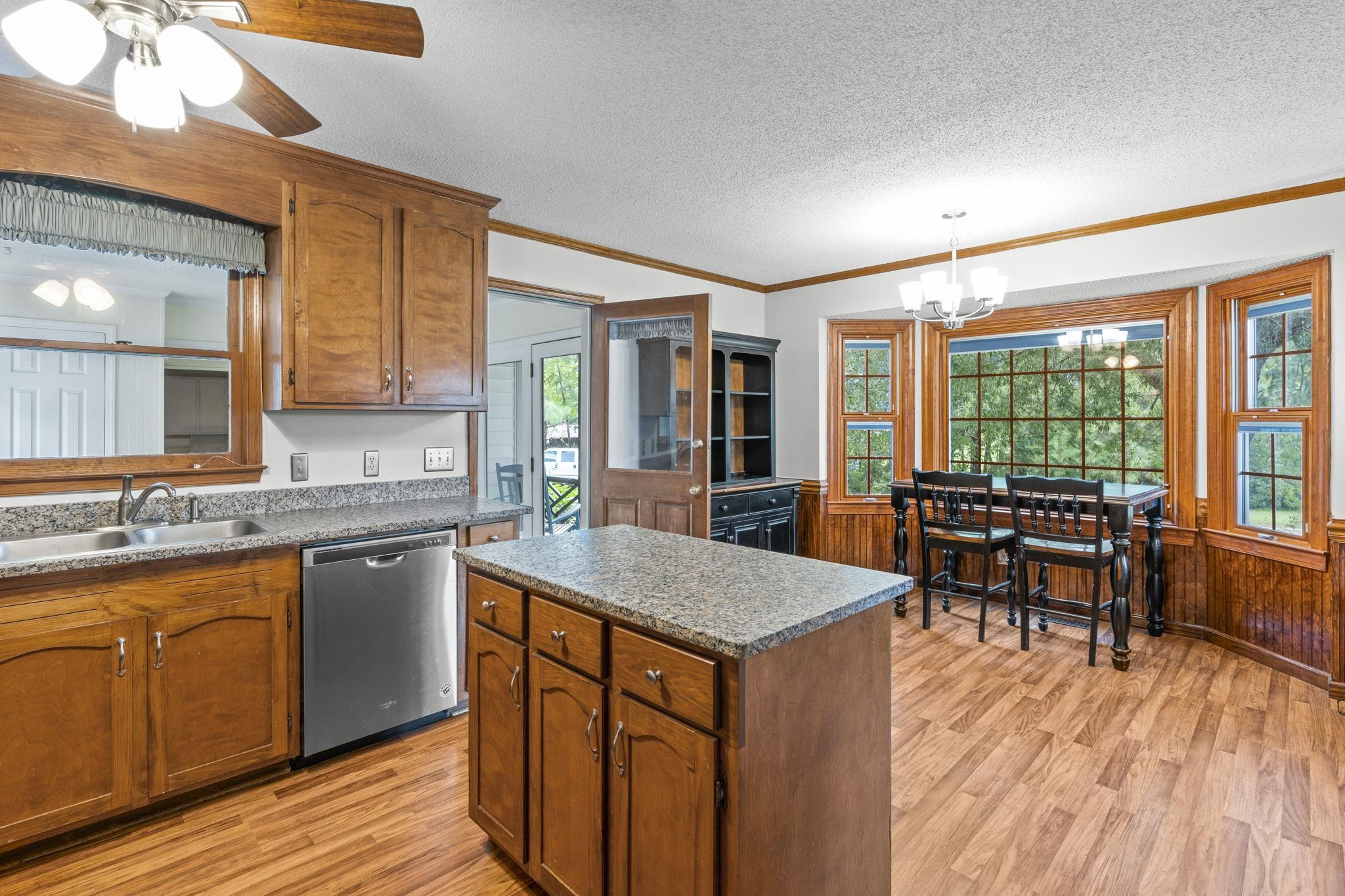 119 Lakeside Circle Willow Spring, NC 27592 - Photo 8 of 37 a kitchen with sink cabinets and wooden floor