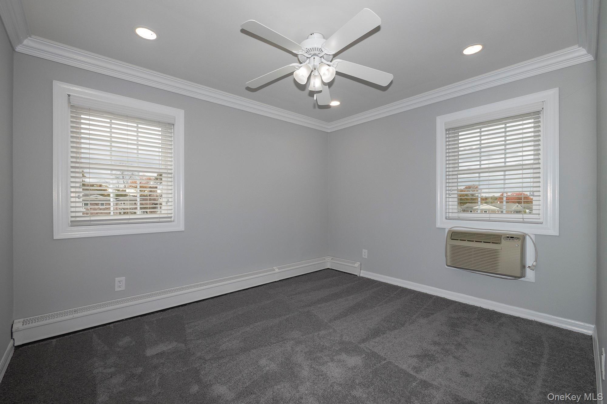 55 Fairfield Way, Unit HE03 Commack, NY 11725 - Photo 7 of 9 a view of an empty room with a window